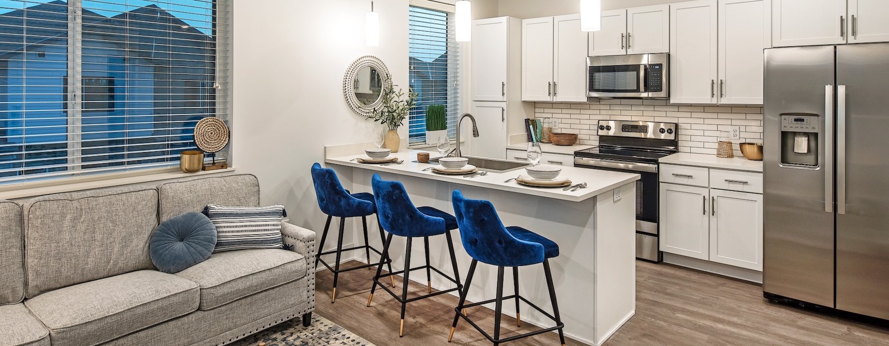 a kitchen with a couch and a table