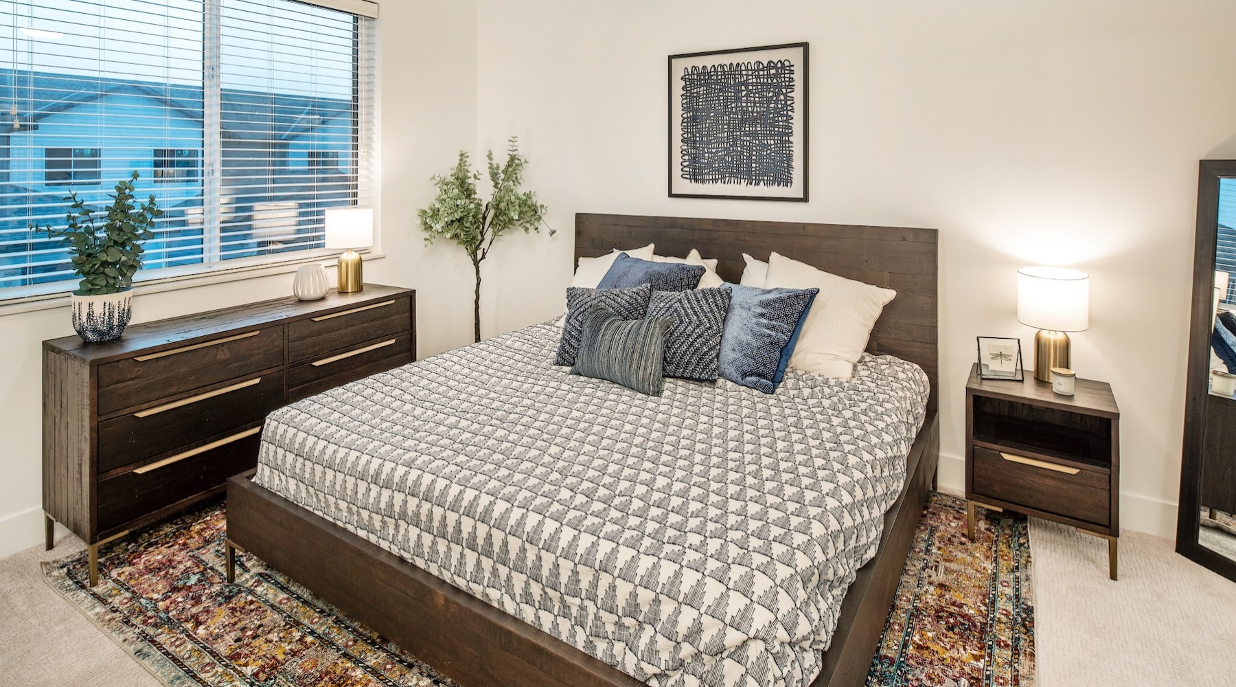 a bedroom with a bed and a dresser